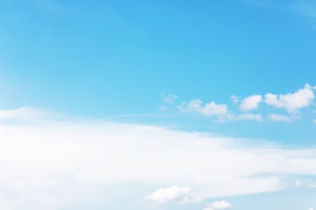 Blue sky background and white clouds soft focus, and copy space.の写真素材