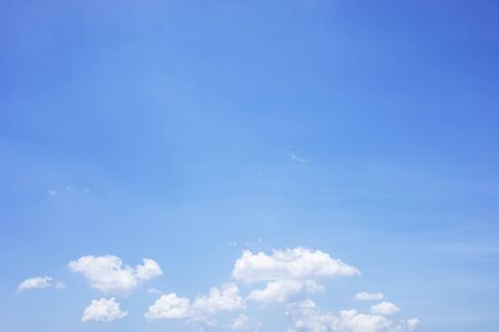 Blue sky background and white clouds soft focus, and copy space.の写真素材