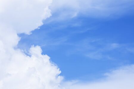 Blue sky background and soft white clouds, copy space.の写真素材
