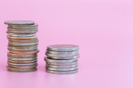Silver coins on the pink backgroundの写真素材