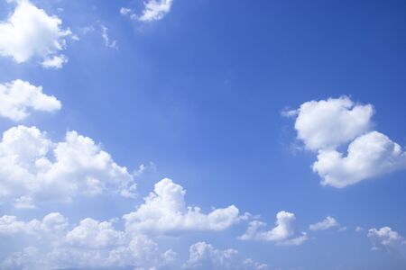 Blue sky background and white clouds soft focus, and copy space.の写真素材