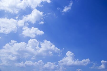 Blue sky background and soft white clouds, copy space.の写真素材