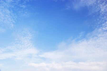Blue sky background and white clouds soft focus, and copy space.の写真素材
