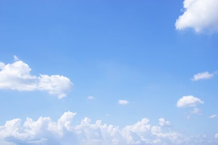Blue sky background and white clouds soft focus, and copy space.の写真素材