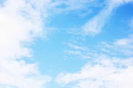 Blue sky background and white clouds soft focus, and copy space.の写真素材