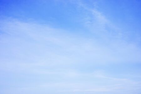 Blue sky background and white clouds soft focus, and copy space.の写真素材