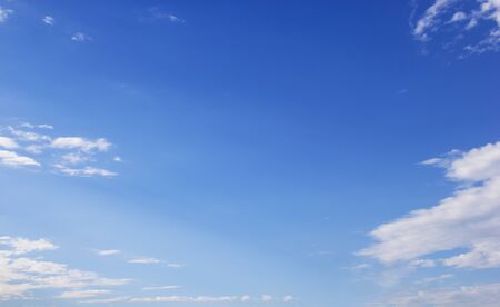 Blue sky background and white clouds soft focus, and copy space.の写真素材