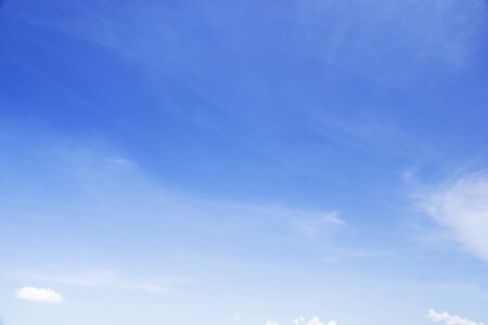 Blue sky background and white clouds soft focus, and copy space.の写真素材