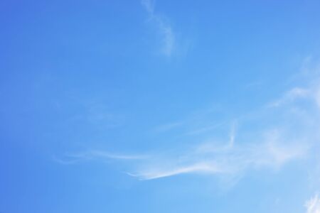 Blue sky background and white clouds soft focus, and copy space.の写真素材