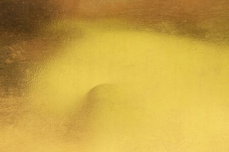 Gold abstract background or texture smooth and gradients shadow. Soft focus.