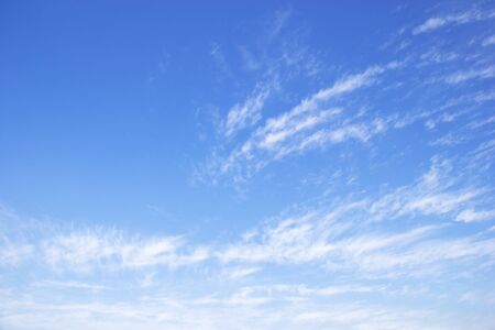 Blue sky background and white clouds soft focus, and copy space.の写真素材
