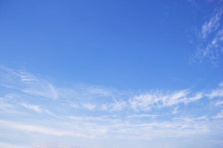 Blue sky background and white clouds soft focus, and copy space.の写真素材