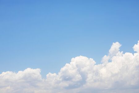 Blue sky background and white clouds soft focus, and copy space.の写真素材