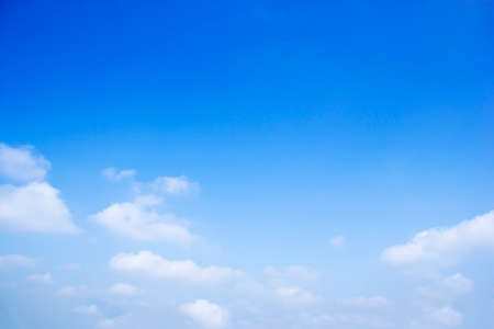 Blue sky background and white clouds soft focus, and copy space horizontal shape.の写真素材