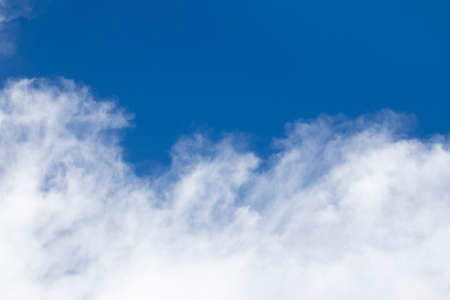 Blue sky background and white clouds soft focus, and copy space horizontal shape.の写真素材