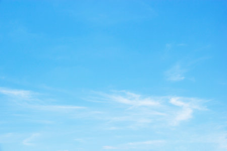 Blue sky background and white clouds soft focus, and copy space horizontal shapeの写真素材