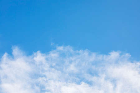 Blue sky background and white clouds soft focus, and copy space horizontal shapeの写真素材