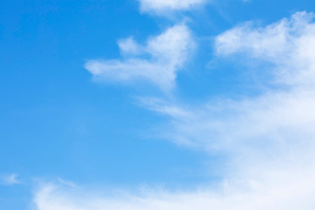 Blue sky background and white clouds soft focus, and copy space horizontal shapeの写真素材