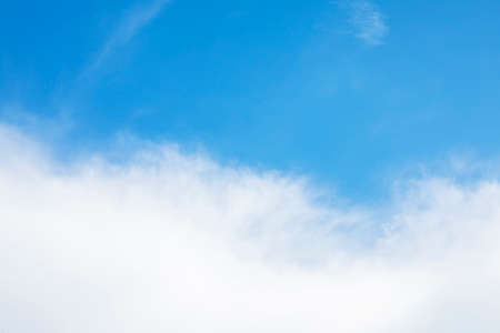 Blue sky background and white clouds soft focus, and copy space horizontal shapeの写真素材