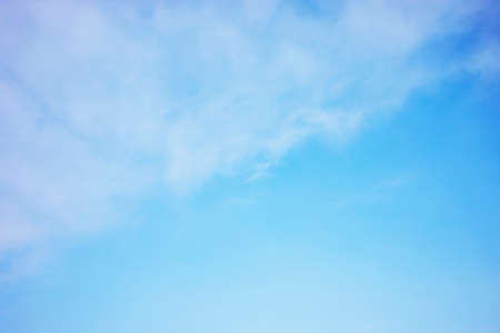 Blue sky background and white clouds soft focus, and copy space horizontal shapeの写真素材