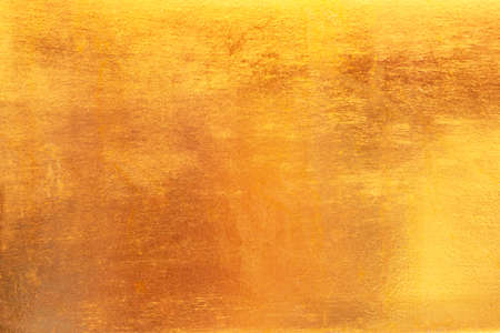 Gold dirty abstract background or texture distress  scratch and gradients shadow.の写真素材