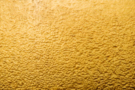 Gold abstract concrete wall background or textureの写真素材