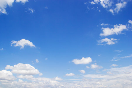 Blue sky background and white clouds soft focus, and copy space horizontal shape.の写真素材