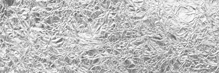 Shiny silver gray foil background or texture,horizontal shape with space for design. Web banner. Wide. Panoramic. Website headerの写真素材