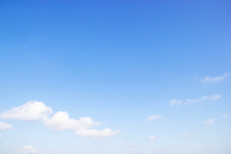 Blue sky background and white clouds soft focus, and copy space horizontal shape.の写真素材
