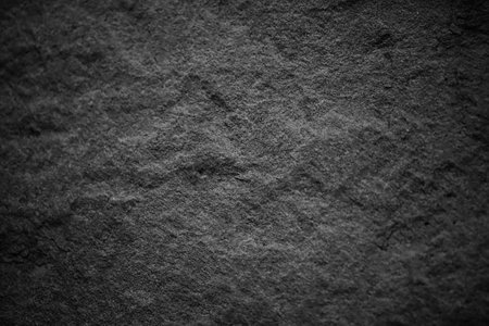 Dark gray black slate stone background or texture and gradients shadowand, horizontal shape with space for designの写真素材