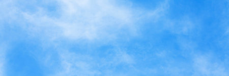 Fantastic soft white clouds against blue sky and copy space horizontal shape. Web banner. Website...