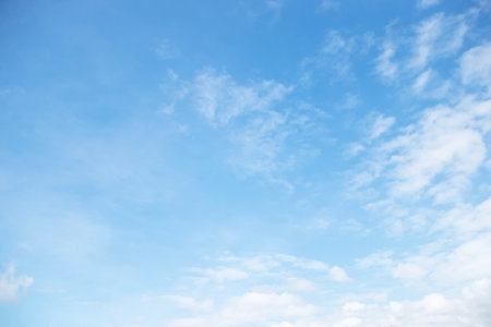 Blue sky background and white clouds soft focus, space in the middle, horizontal shape.の写真素材