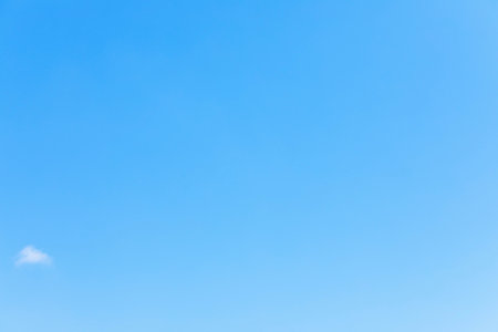 Clear blue sky background and empty space for your design.の写真素材