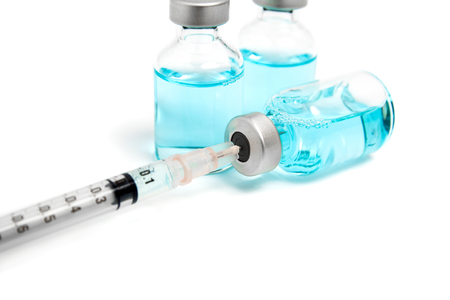 Drug injection with hypodermic syringeの写真素材