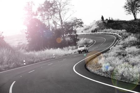 curve road in the mountain and forest, country road in north of Thailand on black and whiteの写真素材