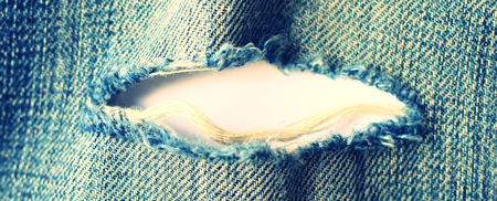 Ripped vintage jeans with white space for textの写真素材