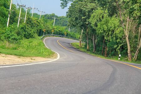 curve road in the mountain and forest, country road of Thailandの写真素材