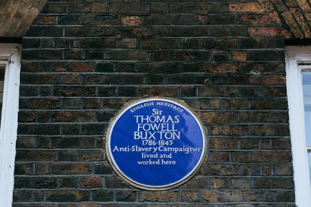 Blue plaque installed on a Brick Lane to commemorate a link between location and Sir Thomas Fowell Buxtonのeditorial素材