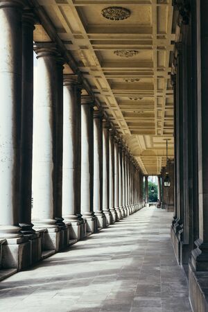 London, UK - July 23, 2018: Colonnade of the Royal Naval College, the former training site of Officers in the British Royal Navy until 1998 which is now open to the publicのeditorial素材