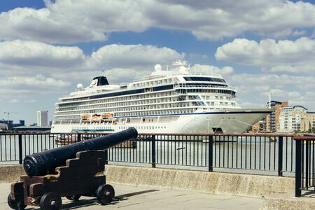 London, UK - July 23, 2018: Viking Sea Cruise Ship moored in Greenwich Ship Tier, English cannon on the foreground, London, UKのeditorial素材