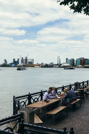 London, UK - July 23, 2018: tourists having lunch on the Thames Bank near Royal Naval College in Greenwich, Londonのeditorial素材