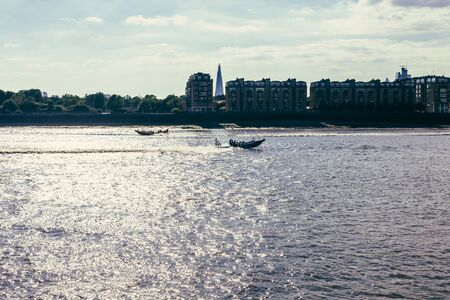 London, UK - July 23, 2018: South Bank of the river Thames on a warm sunny day, The Shard skyscraper on the backgroundのeditorial素材