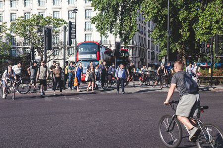 London/UK - 22/07/19: people crossing Park Lane near Marble Arch. The area around the arch forms a...