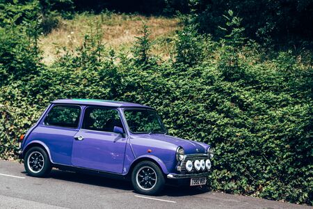 London/UK - 17/07/2019: purple Mini parked on a side of the road. The original is considered an icon of the 1960s British popular culture; was voted the second most influential car of the 20th centuryのeditorial素材