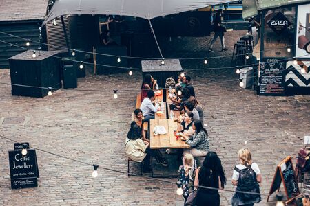 London/UK - July 17, 2019: people eating their food at Camden Market sitting area. Camden Market is...