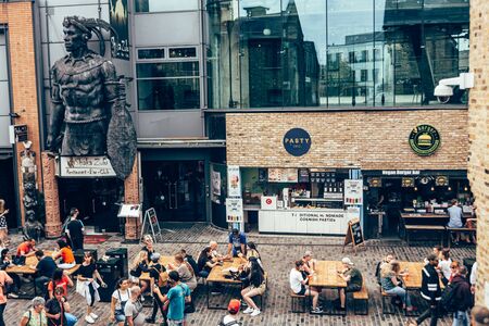 London/UK - July 17, 2019: people eating their food at Camden Market sitting area. Camden Market is...