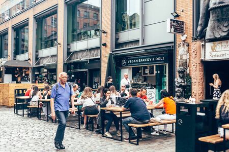 London/UK - July 17, 2019: people eating their food at Camden Market sitting area. Camden Market is...