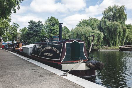 London/UK - 17/07/2019: narrowboat moored along the Regents Canal in Little Venice. A narrowboat is a boat of a particular design, made to fit the narrow canal locks of the United Kingdomのeditorial素材