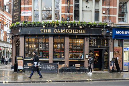 London / UK - Dec 01, 2019:  people walking past the Cambridge pub on Neal Street in London, UK. Pubs are big part of British culture. Selective focusのeditorial素材