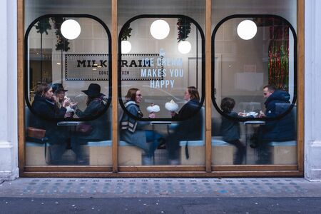 London / UK - Nov 24, 2019: people sitting inside the Milk Train ice cream cafe on Tavistock street...